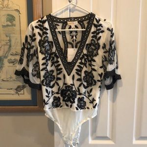 Black and white embroidered bodysuit